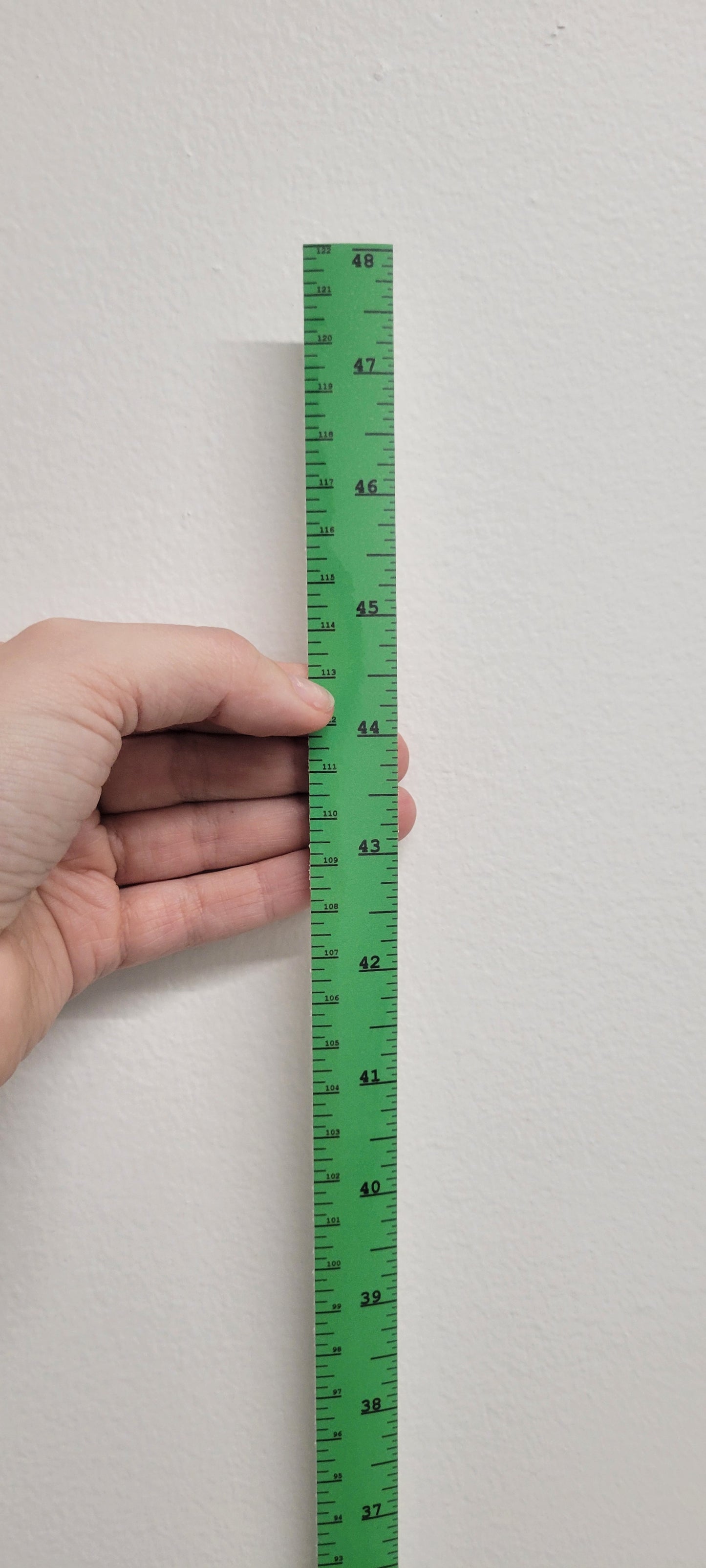 InkBird Print Studio vertical adhesive vinyl ruler in white, showing 41–48 cm, clear bottom-to-top markings, held on a wall.