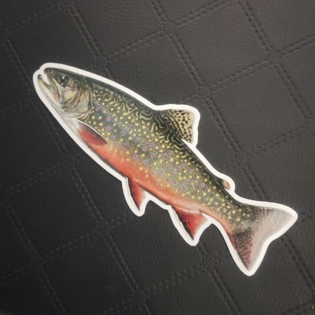 InkBird Print Studio vinyl die-cut fish sticker, vibrant green/yellow spots, red belly, shown on black grid; adhesive back. Printed for Good Days Marina