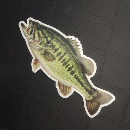 InkBird Print Studio die cut vinyl sticker of green and yellow largemouth bass with dark spots, premium adhesive, on black grid. Printed for Good Days Marina