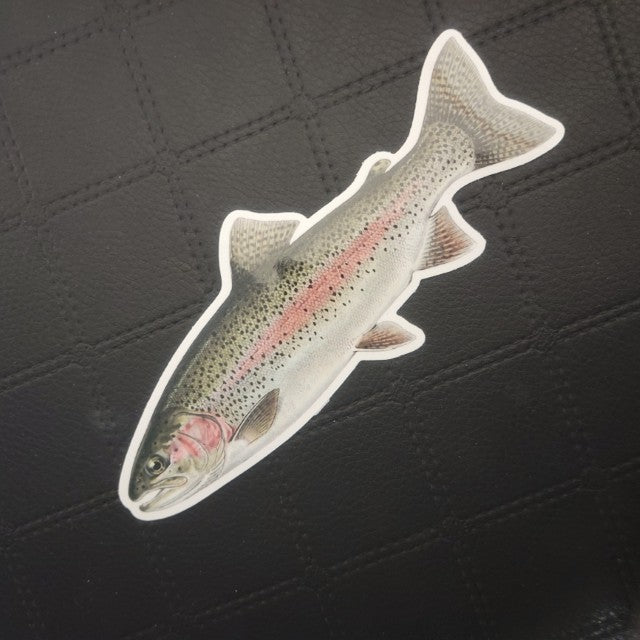 InkBird Print Studio LLC die-cut vinyl sticker of a colorful rainbow trout with pink stripe, glossy finish, on black diamond-textured background. Printed for Good Days Marina