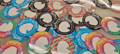 Custom vinyl die cut stickers by InkBird Print Studio in rainbow, black, and candy cane stripes; adhesive peel-back.