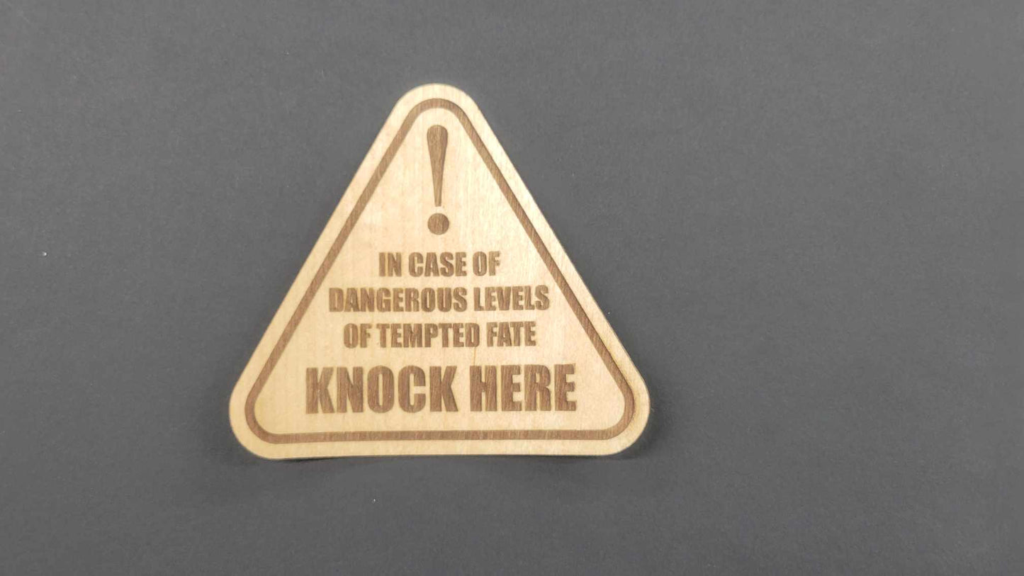 Laser-cut wood veneer triangle sticker with exclamation mark, Knock Here message "knock on wood" is the joke; adhesive backing; light brown wood; unique gift.