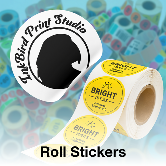 A roll of round sticker labels and a large sample sticker shown on a colorful blurred background. The sticker design features a black silhouette logo with the text 'InkBird Print Studio' on a white circle, and repeated circular labels on the roll with a yellow center reading 'BRIGHT IDEAS' and 'Creativity, Brightened.