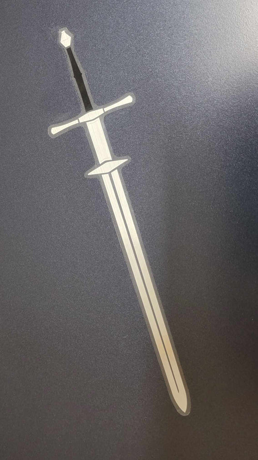 Vinyl Zweihander sword sticker, metallic foil finish, black and silver hilt, long silver blade on dark gray background.