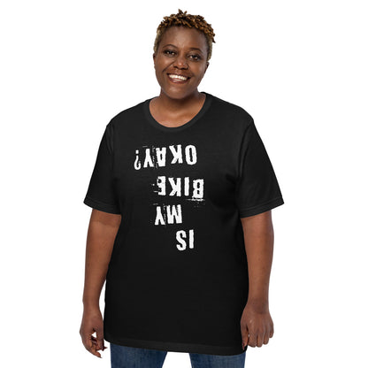Black cotton Is My Bike Okay? T-shirt with white distressed upside-down text, modeled on plain background; unisex fit, MTB gift.