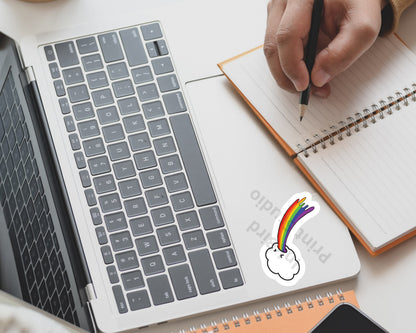 Vinyl Rainbow Cloud Sticker by InkBird Print Studio on a laptop; colorful, weatherproof adhesive, unique cloud and rainbow design.